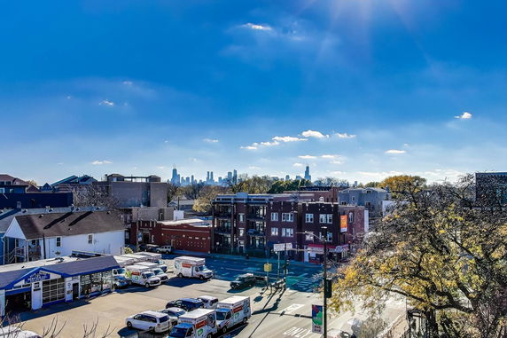 Panoramic view of urban area with city skyline in the distance.