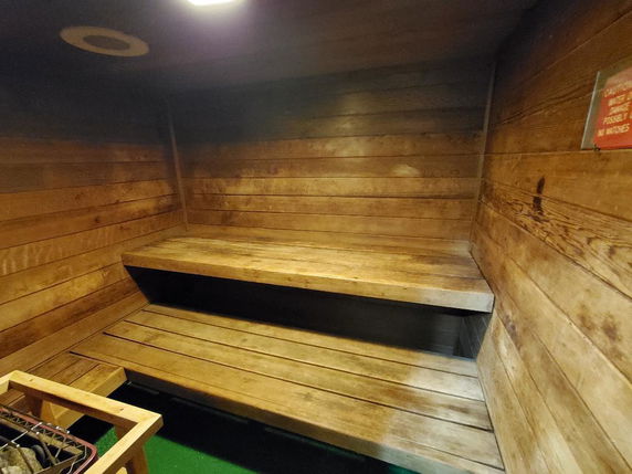 Interior of a wooden sauna room with benches.
