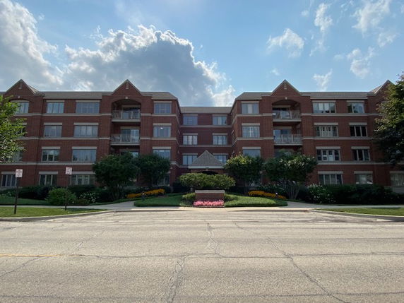 Front view of a multi-story brick building.