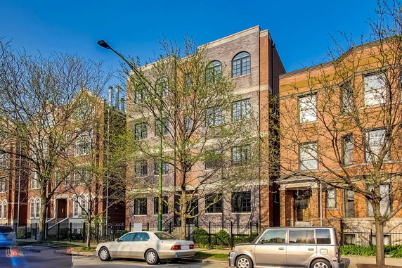 Front view of a multi-story brick residential building.