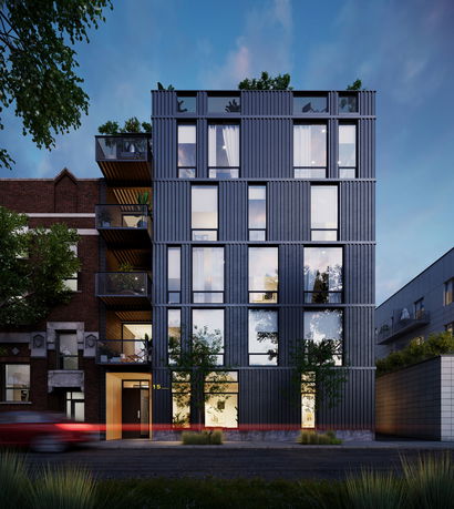 Front view of a multi-story modern apartment building with large windows and balconies.