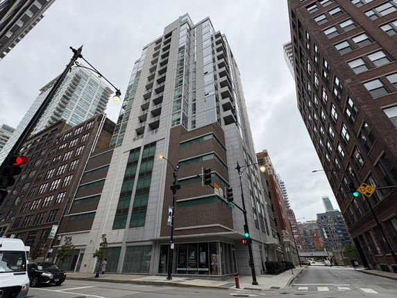 Front view of a modern multi-story building in an urban area.