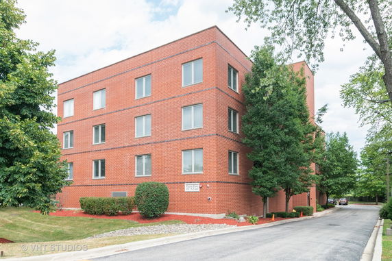 Front view of a multi-story brick building.