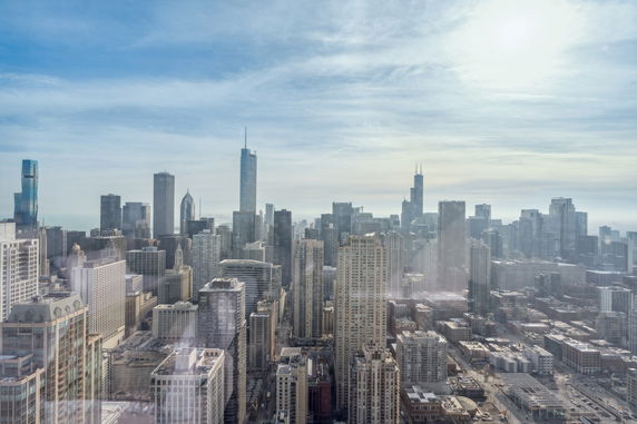 Panoramic view of a cityscape with numerous skyscrapers and buildings.
