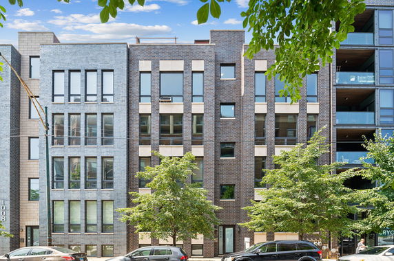 Front view of a multi-story building with modern design.