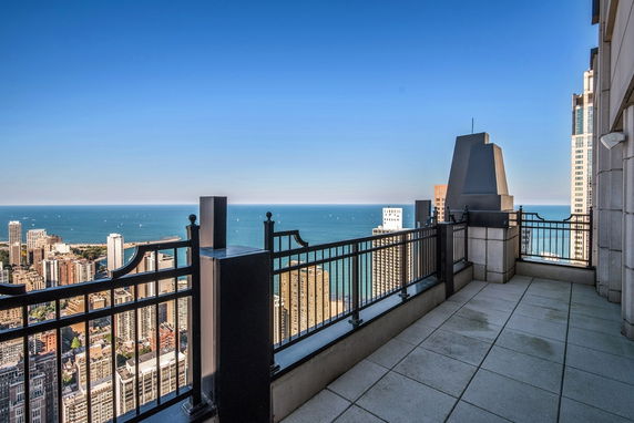 View from a rooftop overlooking the cityscape and ocean.