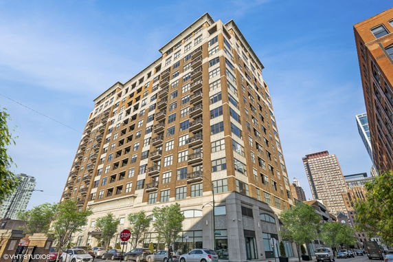 Front view of a multi-story residential building with a modern design.