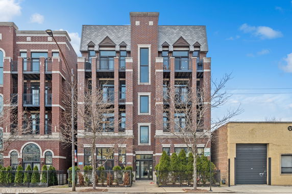 Front view of a multi-story brick building.