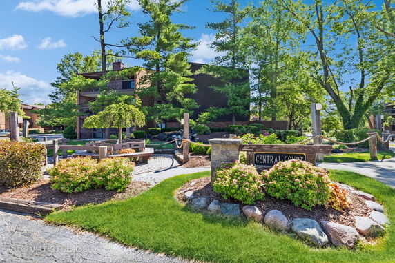 Front view of a multi-story building with landscaping.