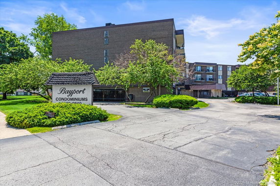Front view of a multi-story condominium building.