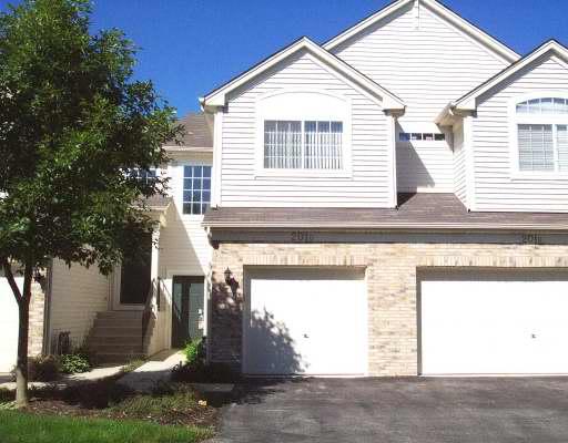 Front view of a two-story house with a double garage.