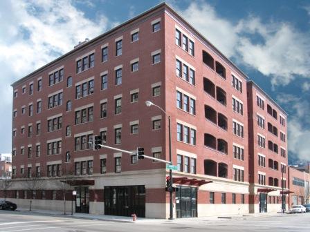Front view of a multi-story brick building.