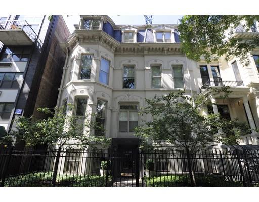 Front view of a multi-story historic building with ornate architectural details.