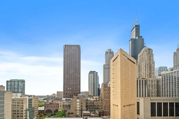 Wide angle view of a cityscape with multiple skyscrapers.