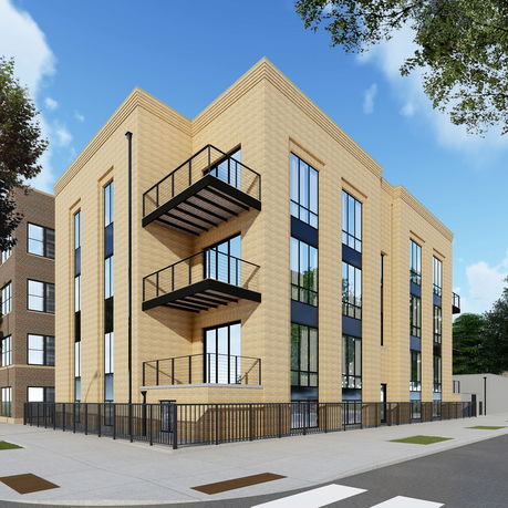 Front view of a modern multi-story building with large windows and balconies.