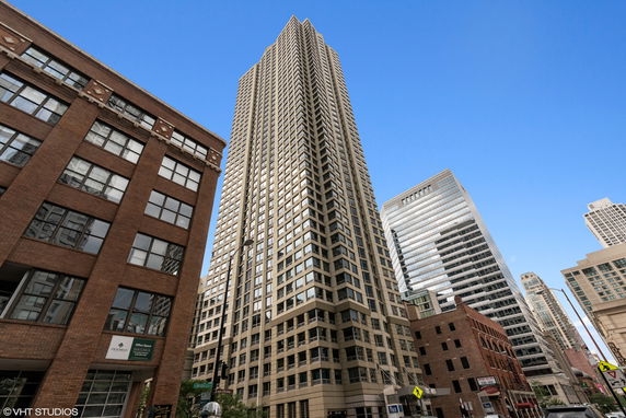 Front view of a tall high-rise building with a contemporary design.