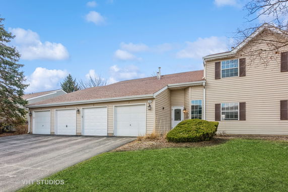 Front view of a house with a triple garage.