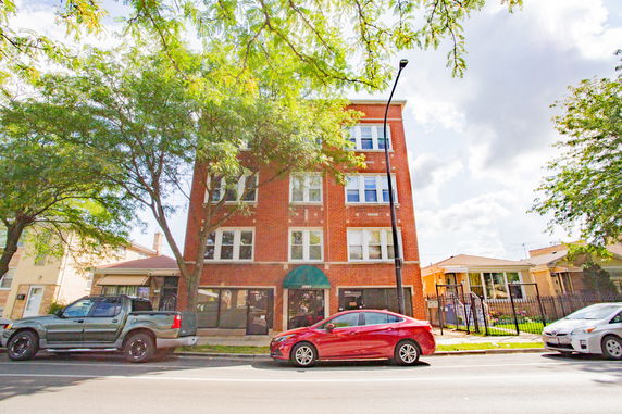 Front view of a multi-story brick building.