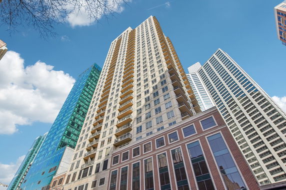 Front view of a high-rise building with balconies.