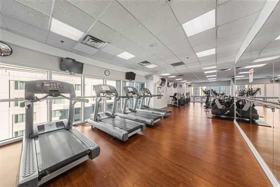 Indoor gym area with treadmills and exercise equipment.
