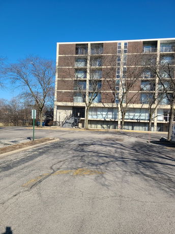 Front view of a multi-story apartment building.