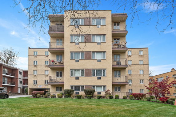 Front view of a multi-story apartment building.