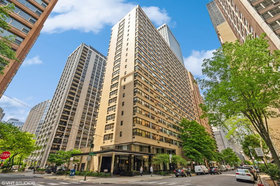 Front view of a tall residential building in an urban setting