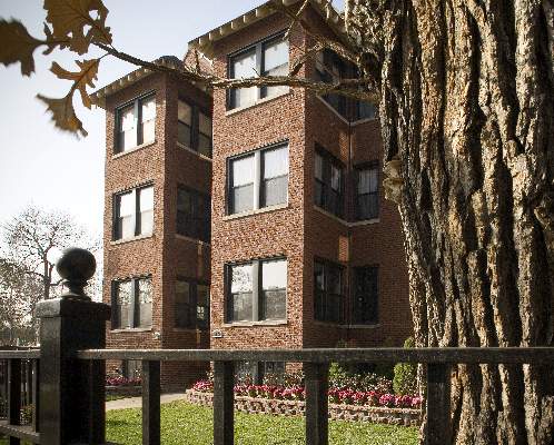 Front view of a multi-story brick building.