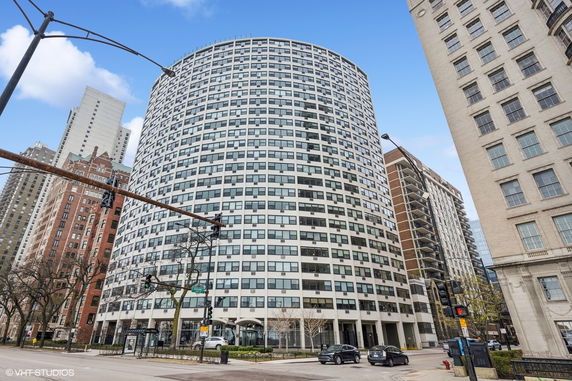 Front view of a high-rise building with a rounded facade.