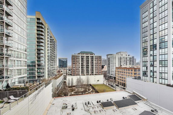 Panoramic view of a cityscape with multiple high-rise buildings.