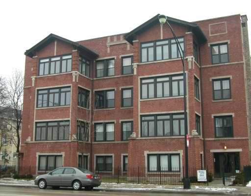 Front view of a multi-story brick apartment building