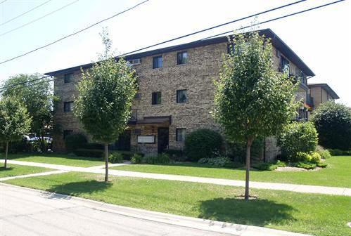 Front view of a three-story brick building.