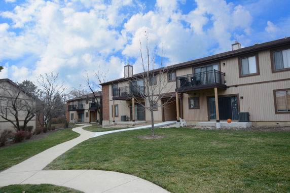 Front view of a two-story residential building with balconies.