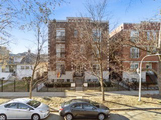 Front view of a multi-story brick apartment building