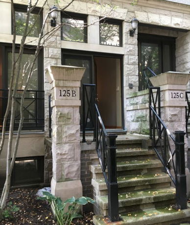 Front view of a building with two stoops labeled 125 B and 125 C.