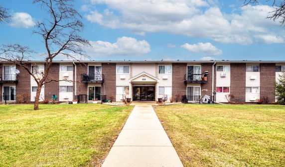 Front view of a multi-story apartment building.