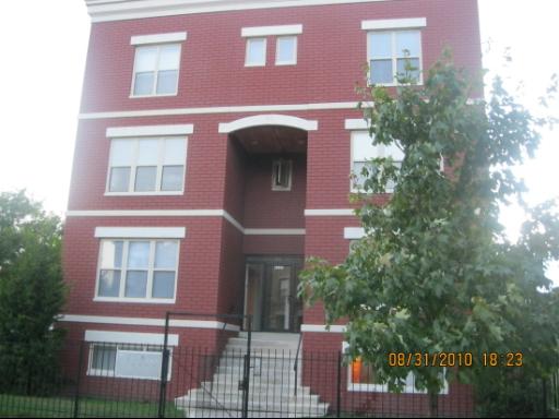 Front view of a three-story brick building.