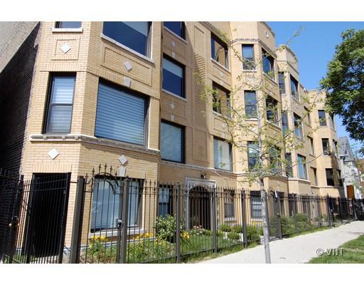 Front view of a multi-story brick apartment building.