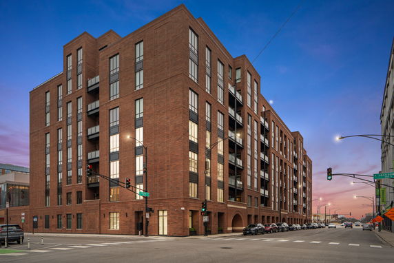 Front view of a multi-story brick building.