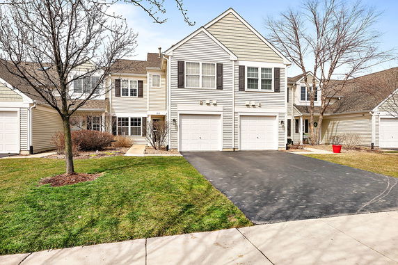 Front view of a two-story house with a double garage.