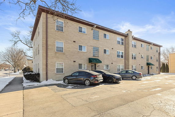 Front view of a three-story apartment building.