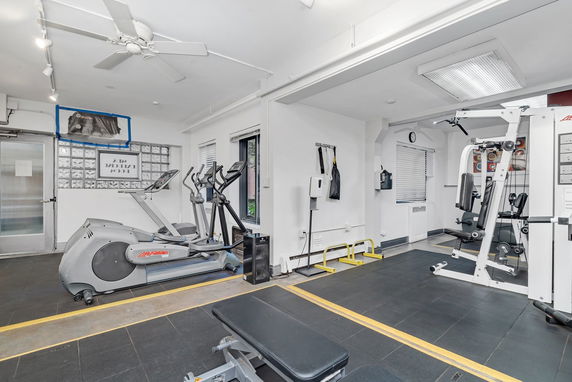 Indoor gym with exercise equipment and machines