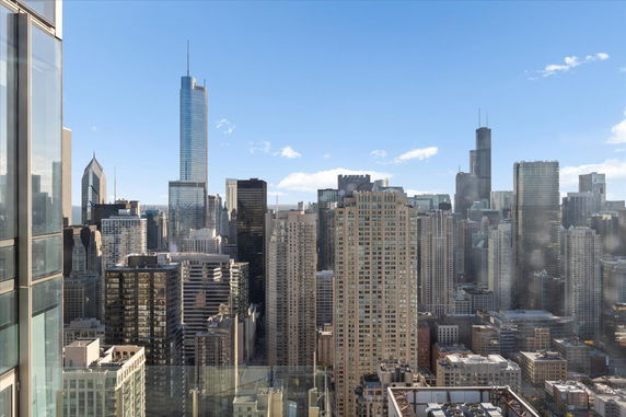 Wide angle view of a city's skyline with numerous tall buildings.