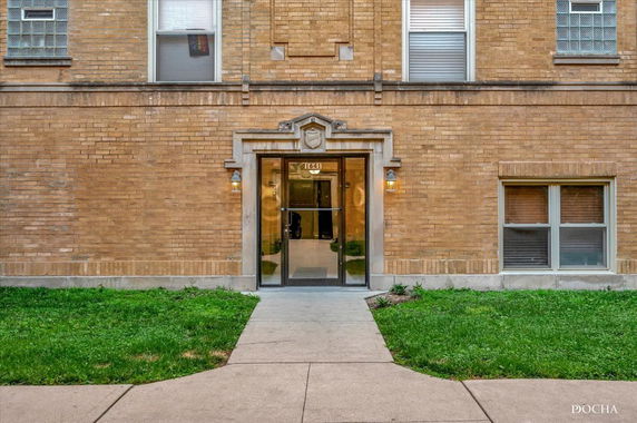 Front view of a brick building entrance.