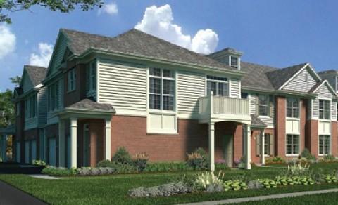 Front view of a two-story house with a balcony and multiple windows.