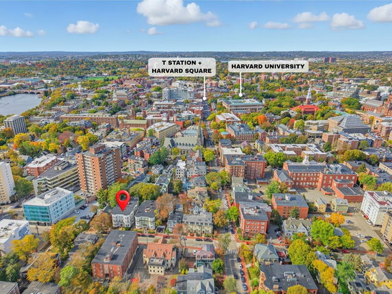 Aerial panoramic view of a cityscape with various buildings and landmarks.
