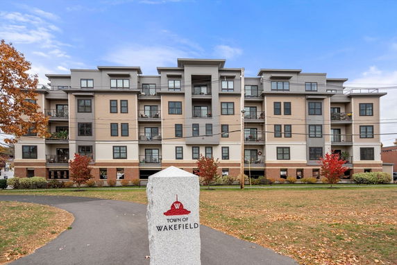 Front view of a multi-story apartment building.