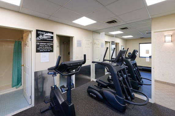 Indoor gym area with treadmills and exercise equipment.
