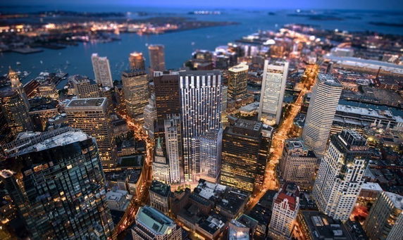 Aerial panoramic view of a cityscape with numerous skyscrapers and buildings.