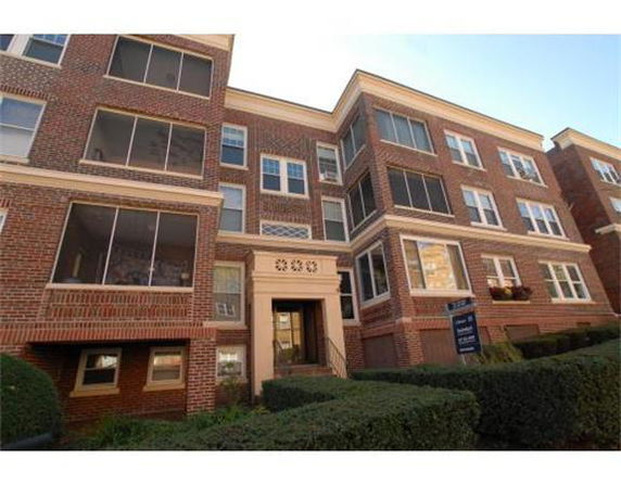 Front view of a multi-story brick apartment building